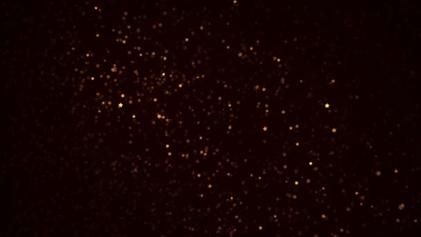 Teilchen von vielen goldenen Sternen auf schwarzem Hintergrund — Stockvideo