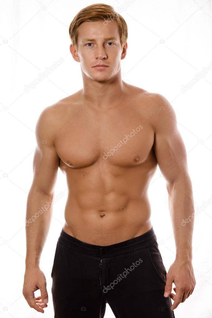 young sexy muscular macho man posing with naked torso 