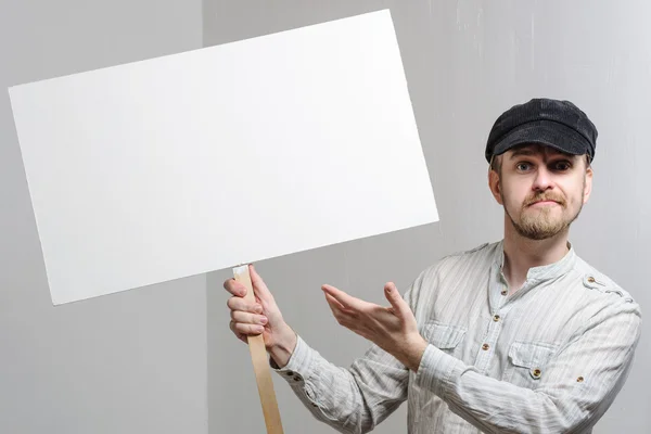 Angry protesting worker with blank protest sign — Stock Photo, Image