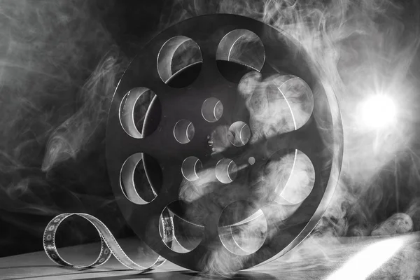 Reel of film retro in the smoke. black and white — Stock Photo, Image