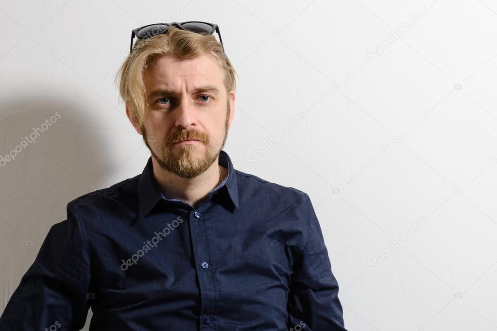 Attractive Man In Blue Shirt And Sunglasses On Her Head Stock Photo Image By C Unomay