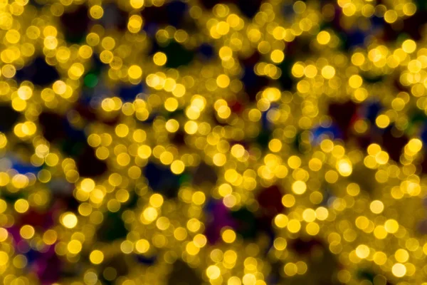 Abstract golden color lights chrismas background. de-focused - image