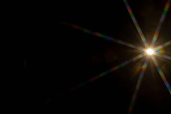 Abstract sun flare. The lens flare is subject to digital correction.