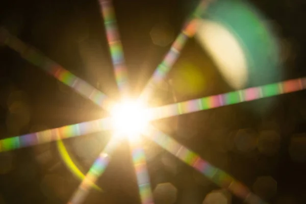 Abstract sun flare. The lens flare is subject to digital correction.