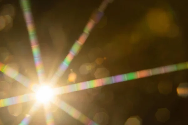 Abstract sun flare. The lens flare is subject to digital correction.