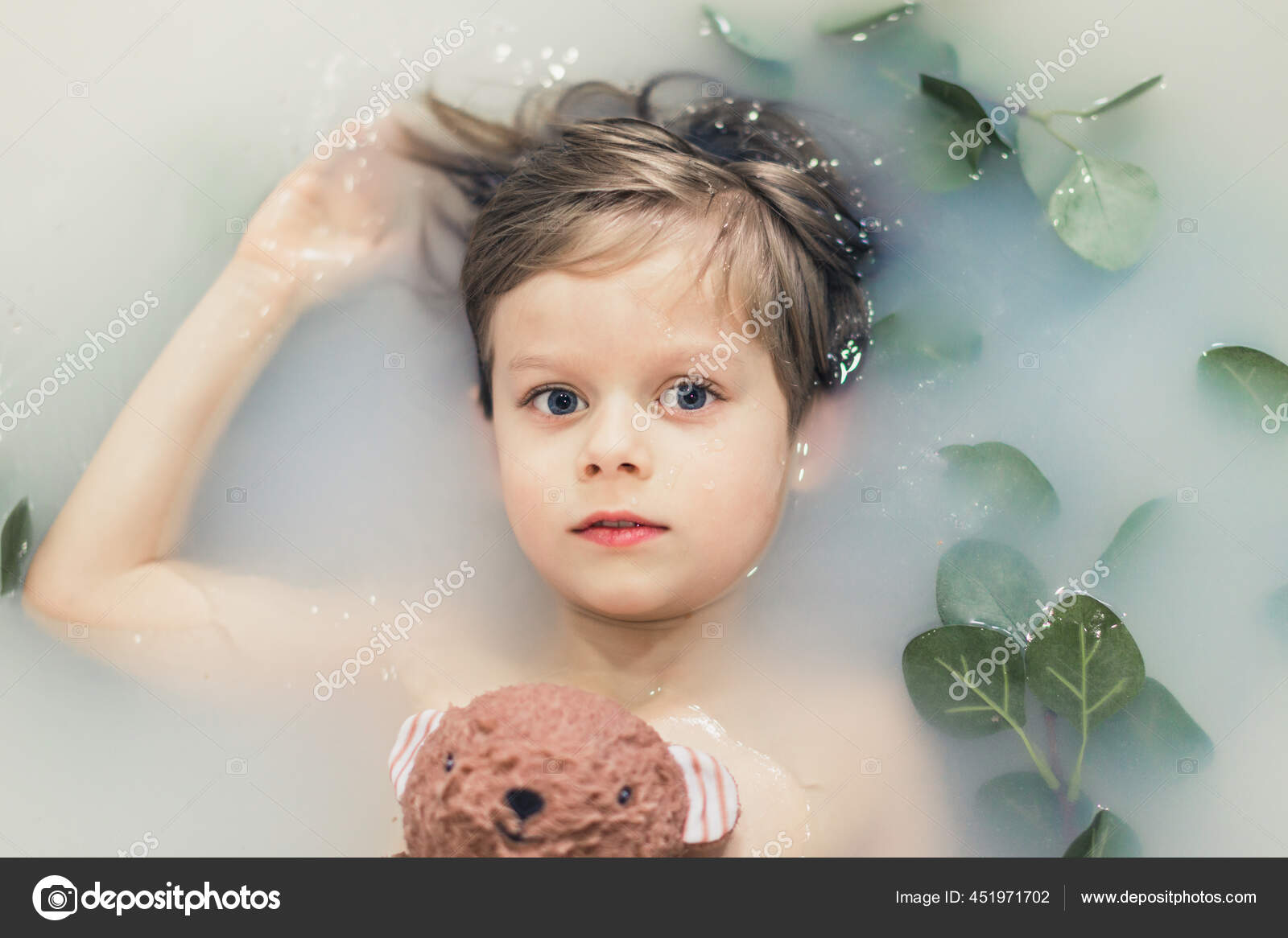 milk-bath-boy-lying-milk-bath-green-leaves-soft-toy-stock-photo-by