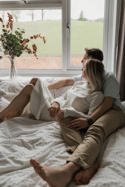 Young Family Man Woman Sitting Bed Looking Out Window — Stock Photo, Image
