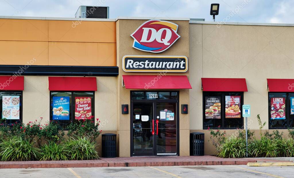 Houston, Texas USA 11-26-2020: Dairy Queen restaurant storefront in Houston, TX. Fast food chain store selling hot food and ice cream.