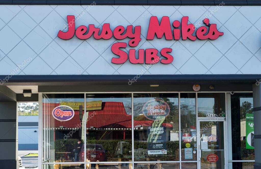 Houston, Texas USA 03-26-2021: Jersey Mike's Subs exterior in Houston, TX. American submarine sandwich chain store founded in 1956.