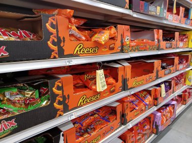 Houston, Texas USA 10-08-2025: Assorted Halloween candy on supermarket aisle shelf.
