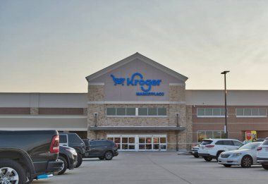 Cypress, Texas USA 08-24-2025: Kroger Marketplace supermarket storefront and parking lot.