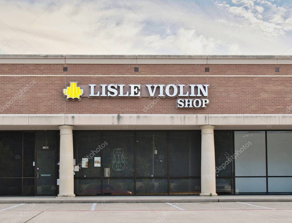 Houston, Texas USA 07-20-2025: Lisle Violin Shop business storefront exterior local strip mall.