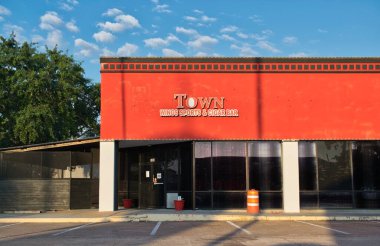 Houston, Texas USA 08-03-2025: Town wings sports and cigar bar business exterior local pub.