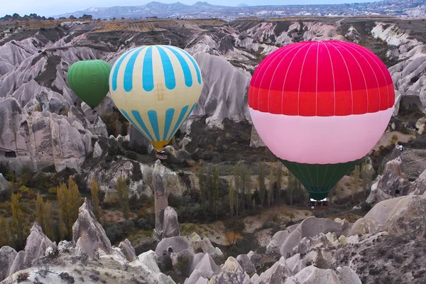 Hot air balloon flying over rock landscape at Cappadocia Turkey — Stock Photo, Image