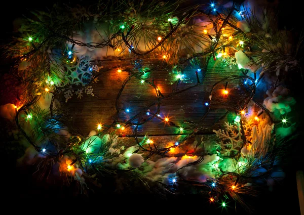 Joulun värikäs valo puinen tausta kopioi tilaa — kuvapankkivalokuva