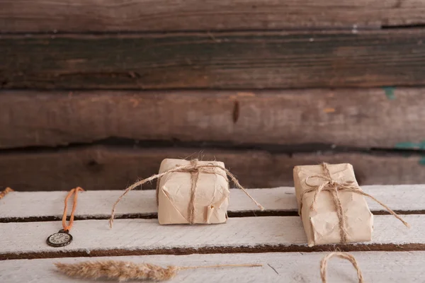 Vintage gift on wooden background — Stock Photo, Image