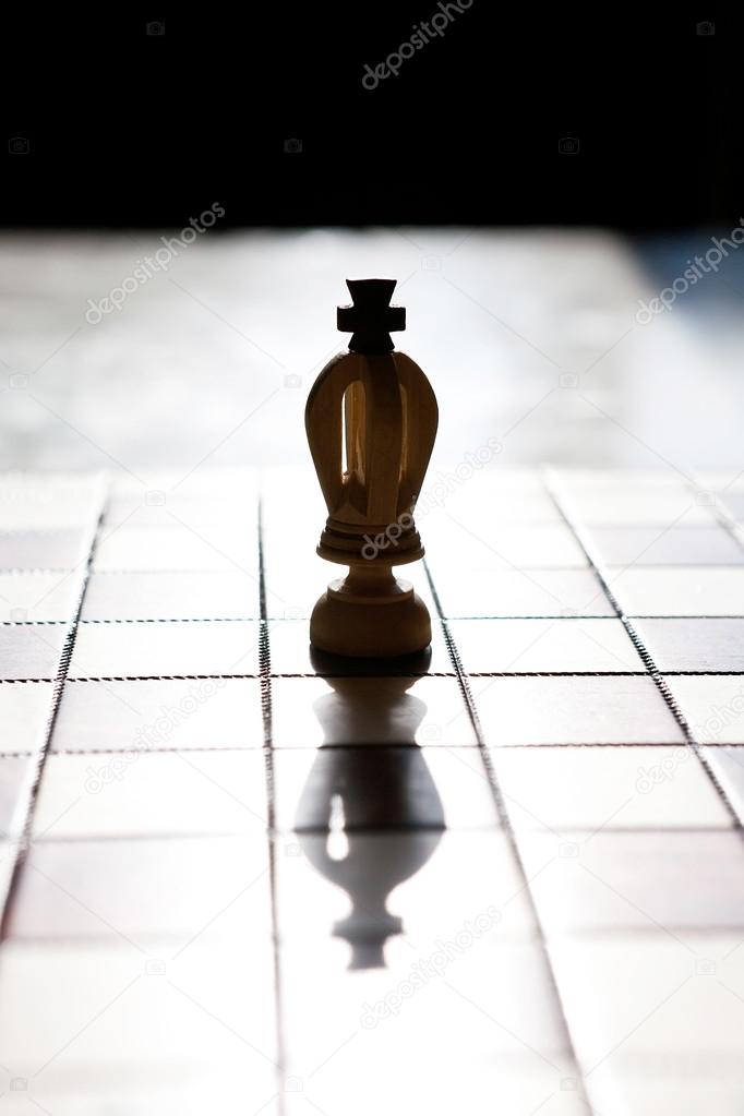 king chess piece with others in background