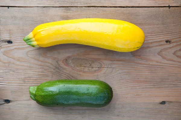 Organic  zucchini on wooden background, top view — Stock Photo, Image