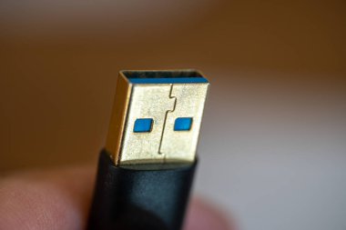 Close up of a USB connection cord side view (macrophotography) for computer connectivity concepts.