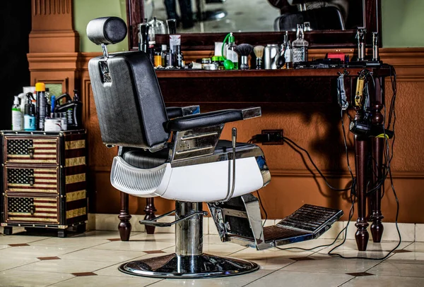 Barber shop chair. Barbershop armchair, modern hairdresser and hair salon, barber shop for men. Stylish vintage barber chair. Professional hairstylist in barbershop interior