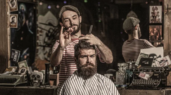 Bearded man in barber shop. Work in the barber shop