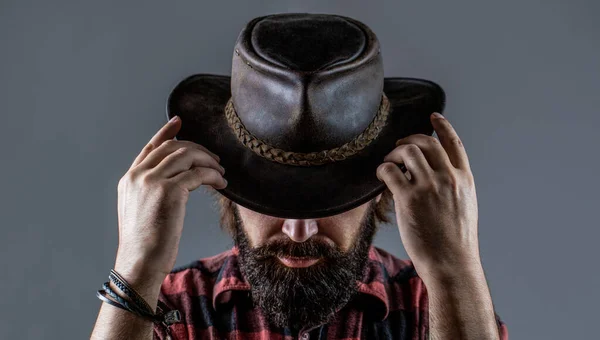 Leather Cowboy Hat. Portrait of young man wearing cowboy hat. Cowboys in hat. Handsome bearded macho. Man unshaven cowboys. American cowboy — Stock Photo, Image