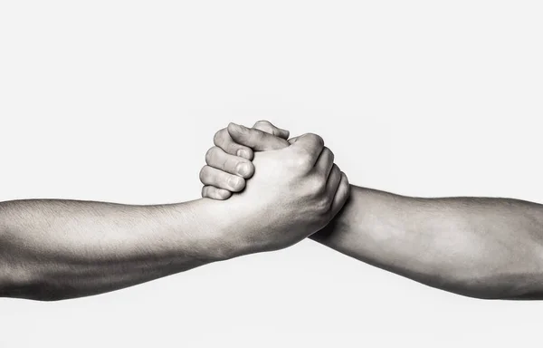 Rescue, helping gesture or hands. Two hands, helping arm of a friend, teamwork. Helping hand outstretched, isolated arm, salvation. Black and white — Stock Photo, Image