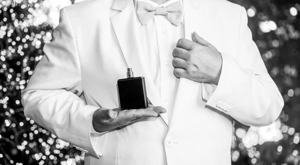 Male fragrance, perfumery, cosmetics. Smell perfume. Expensive suit. Rich man prefers expensive fragrance smell. Man scent perfume. Black and white — Stock Photo, Image