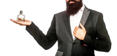 Erkek parfümü, parfüm. Parfüm ya da parfüm şişesi, parfüm, kozmetik, parfüm şişesi, erkek parfümü. Erkek parfümü, takım elbiseli sakallı bir adam. Elinde parfüm şişesi tutan bir erkek.
