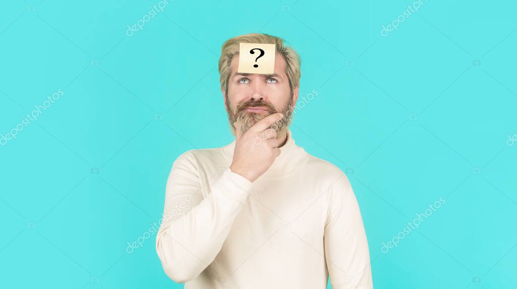Man with question mark on forehead looking up. Paper notes with question marks. Beard man question mark in head, solution problems. Thinking man with question mark on blue background