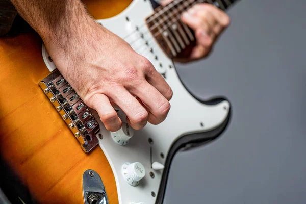 Electric guitar. Repetition of rock music band. Music festival. Man playing guitar. Close up hand playing guitar. Musician playing guitar, live music. Musical instrument — Stok fotoğraf