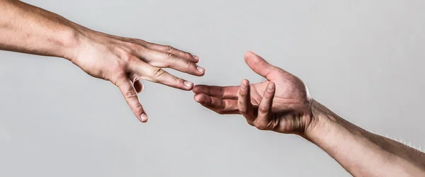 Two hands, helping arm of a friend, teamwork. Helping hand concept and international day of peace, support. Closeup. Helping hand outstretched, isolated arm, salvation. Close up help hand — Stock Photo, Image