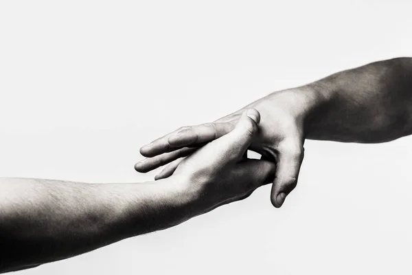 Yardım elini kapat. El konseptine yardım etmek, destek olmak. Uzanmış, izole edilmiş bir kol, kurtuluş. Siyah ve beyaz