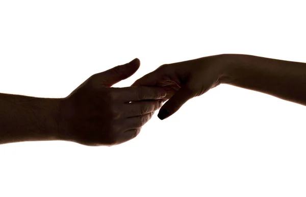 Mercy, two hands silhouette, connection or help concept. Finger Touching hands silhouette man woman white background couple feeling love. Concept human relation, community, togetherness, symbolism — Stock Fotó