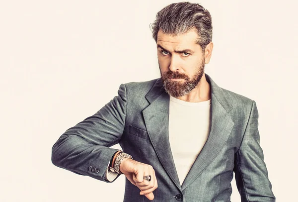 Hand in with wrist watch in a business suit. Elegant handsome man in suit. Sexy male, brutal macho, hipster. Handsome bearded businessman in classic suits. Man in suit. Male beard and mustache