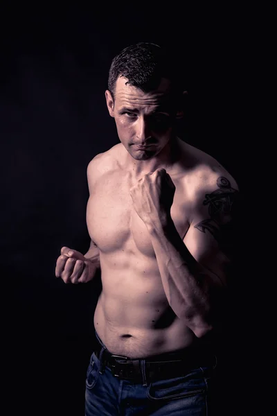 Athletic man in studio — Stock Photo, Image