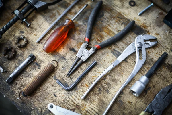 Tools on wooden plank — Stock Photo, Image