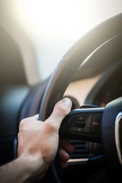 Hands on steering wheel — Stock Photo, Image