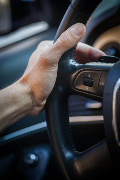 Hands on steering wheel — Stock Photo, Image