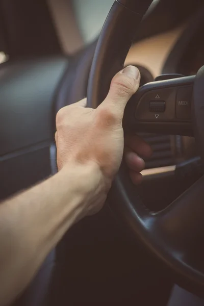 Hands on steering wheel — Stock Photo, Image