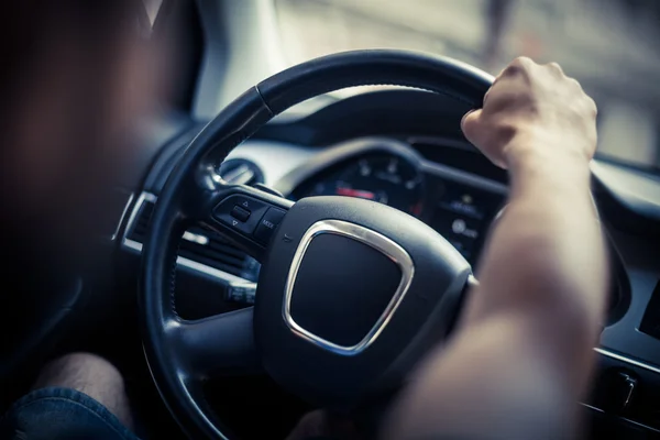 Hands on steering wheel — Stock Photo, Image