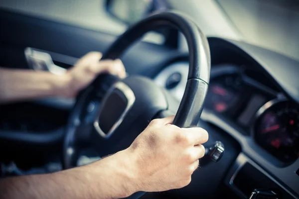 Hands on steering wheel — Stock Photo, Image