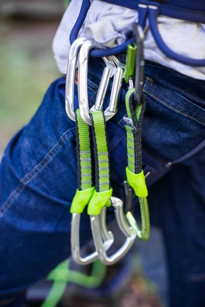 stock image Various rock climbing gear attached to harness.