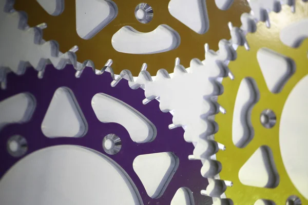 Colored motorcycle sprockets — Stock Photo, Image