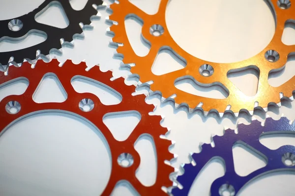 Colored motorcycle sprockets — Stock Photo, Image