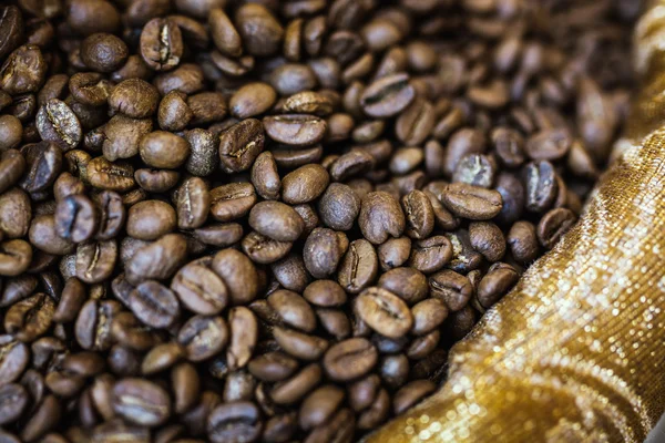 Grãos de café marrom, textura de fundo — Fotografia de Stock