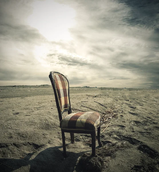 Wooden chair alone on Sand — Stock Photo, Image