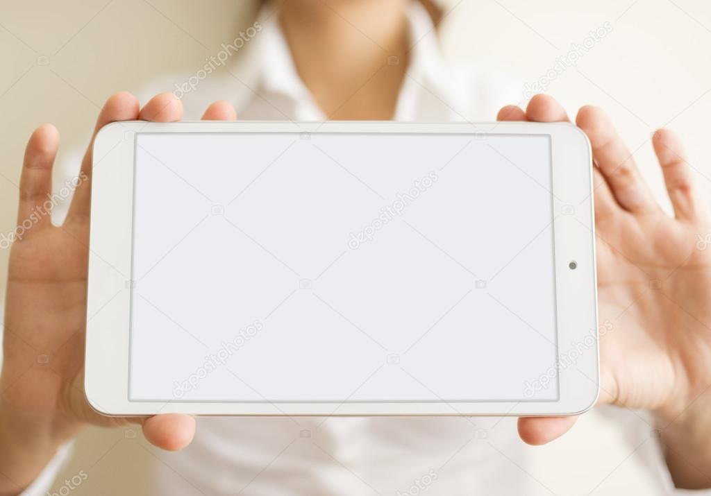 woman hands holding a white tablet or blank page