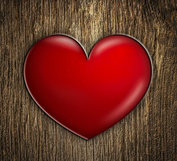 Corazón rojo sobre madera — Foto de Stock