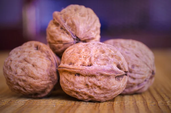 Walnuts on the brown table — Stock Photo, Image